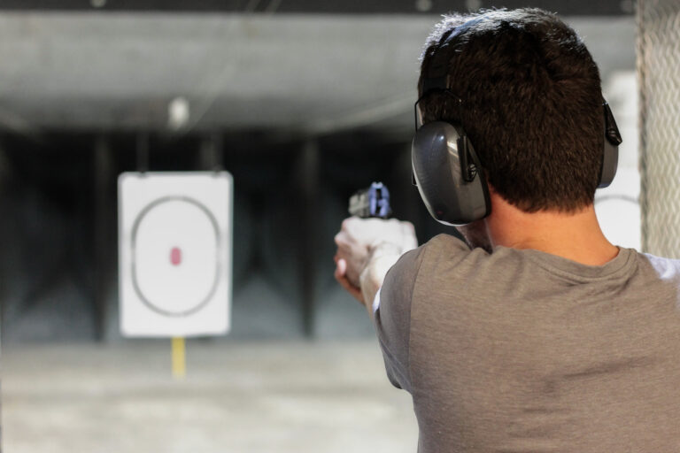 man pointing gun at a target atshooting range amsterdam