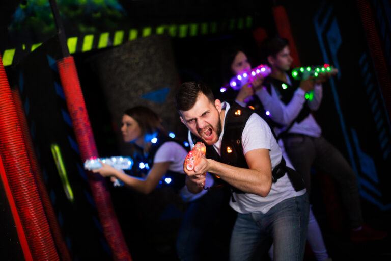 young man playing a laser tag barcelona experience