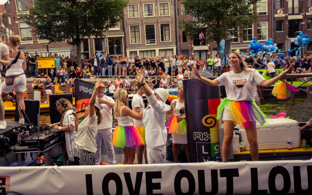 People dancing on a boat during gay pride Amsterdam